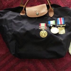 Authentic Longchamp Pliage bag with medals